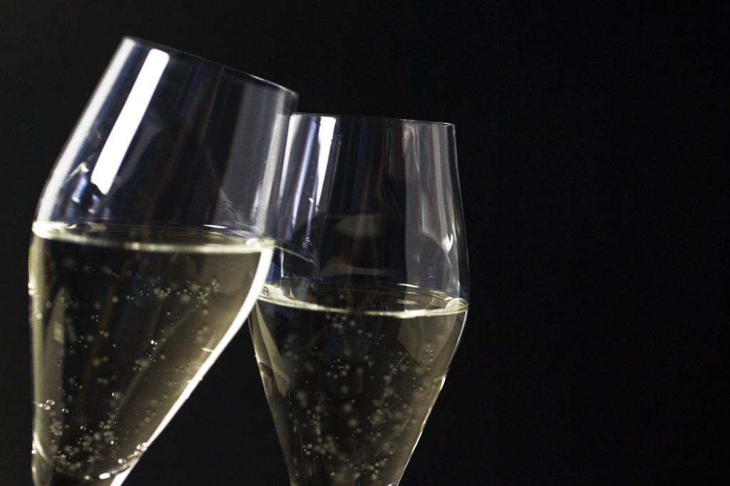 Two champagne glasses representing alcohol consumption at New Year's Eve parties.