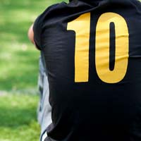 Number ten printed on the back of a young man's shirt.