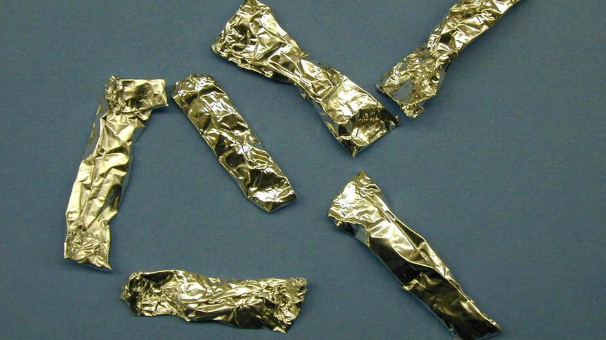 Gold foil wrappers with PCP enclosed.