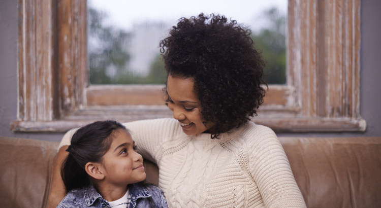 mom sitting with her daughter